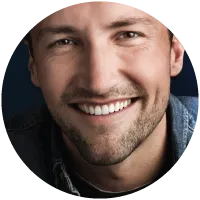 Adult male smiling after orthodontic treatment
